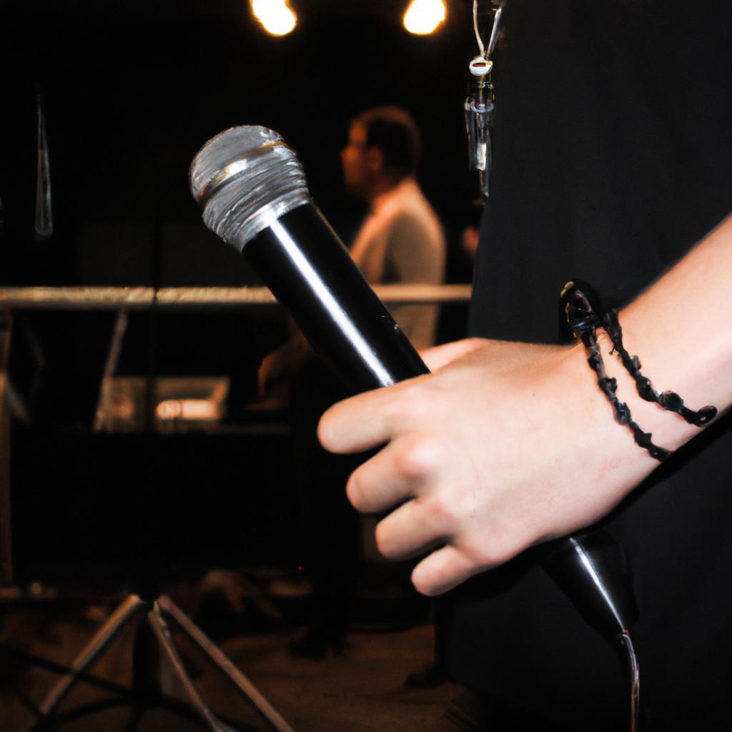Person holding a microphone backstage