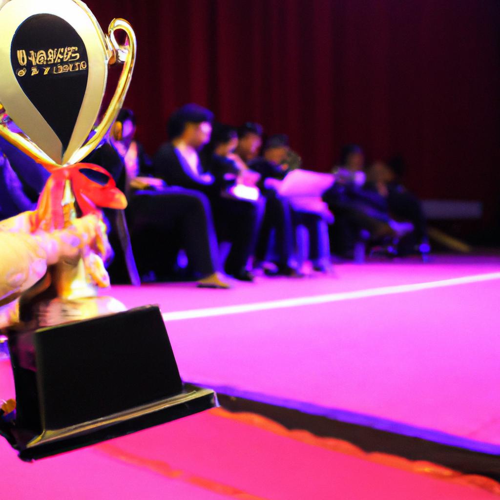 Person holding award on stage