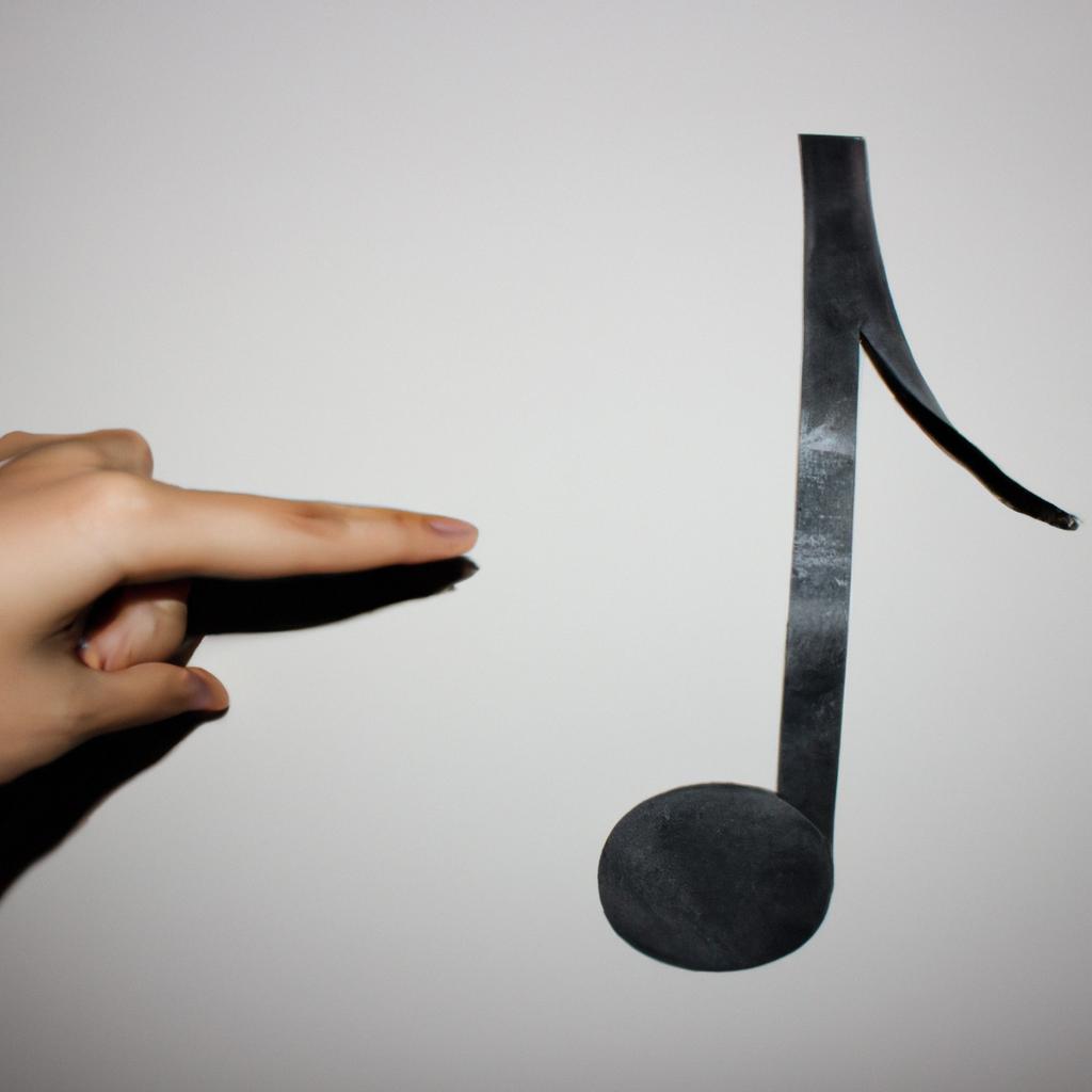 Person holding a music note