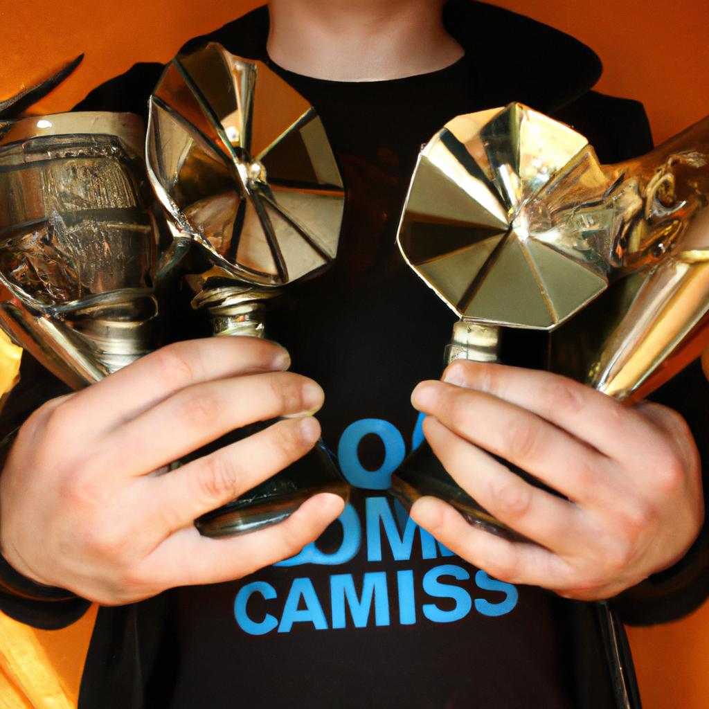 Person holding multiple music awards